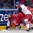 MINSK, BELARUS - MAY 17: Denmark's Jesper Jensen #40 collides with Czech Republic's Michal Vondrka #82 and Jiri Novotny #12 along the boards during preliminary round action at the 2014 IIHF Ice Hockey World Championship. (Photo by Richard Wolowicz/HHOF-IIHF Images)

